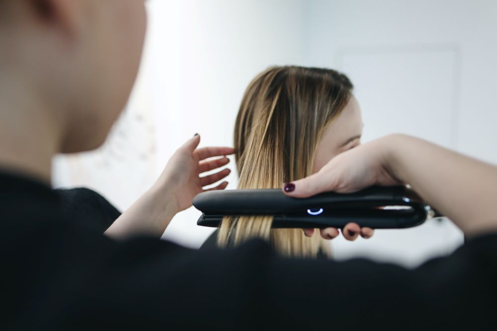 Hairdresser using heat styling tools