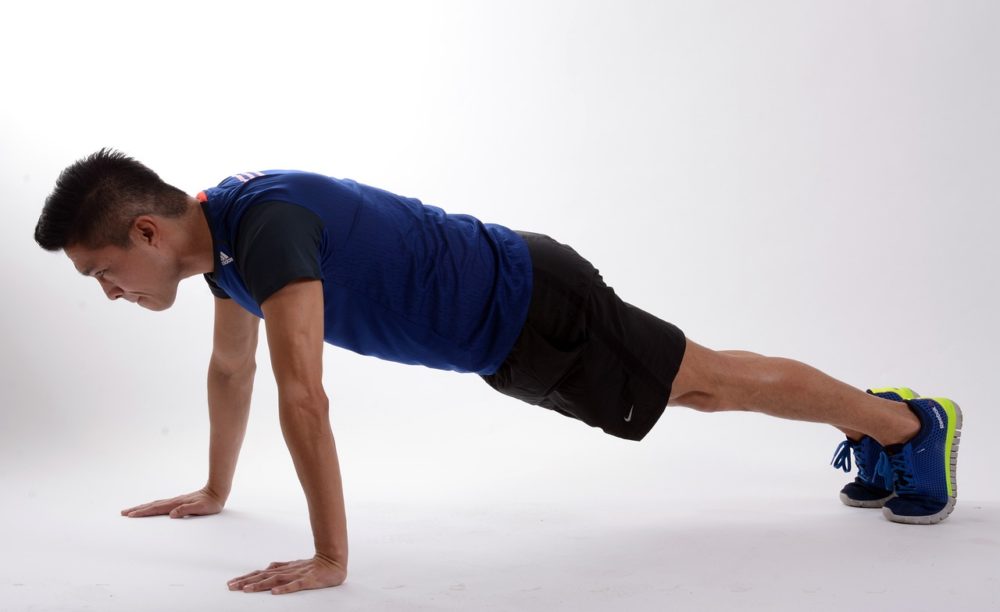 man exercising to improve his back posture.jpg