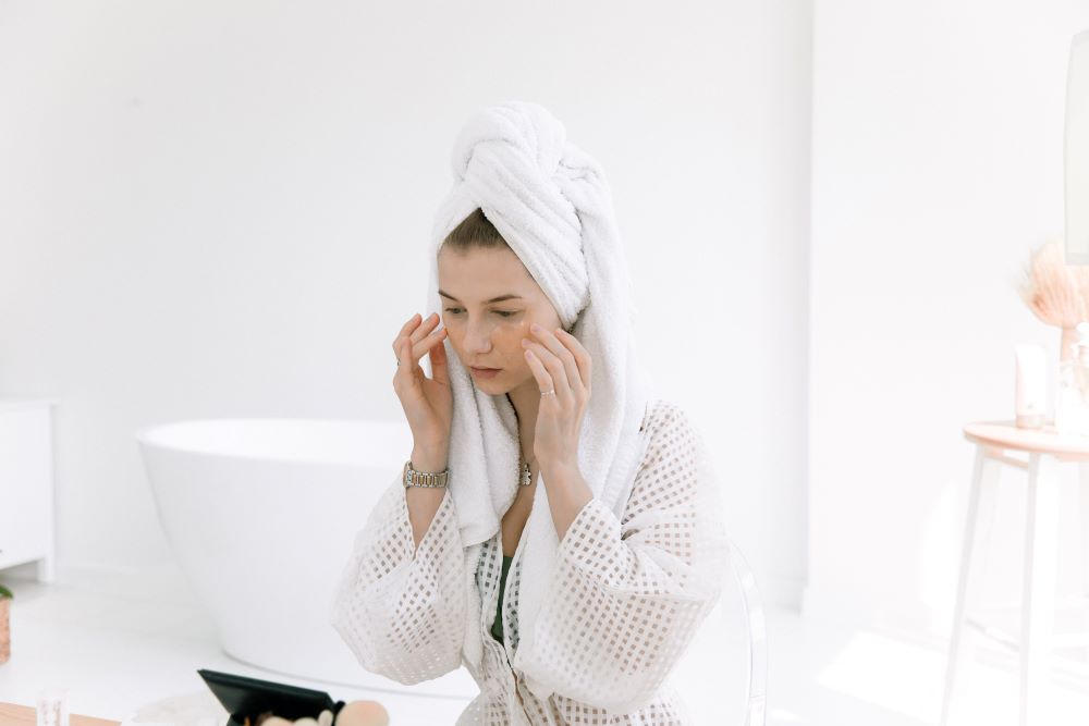 Woman Using Olive Oil in Skincare