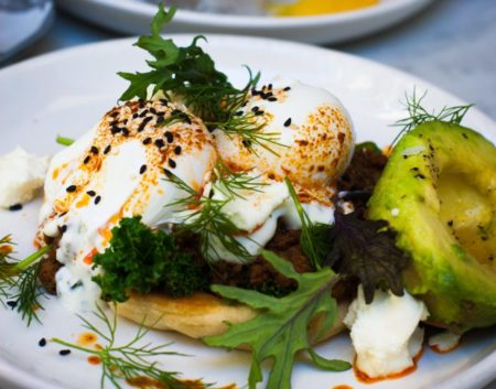 poached eggs over greens