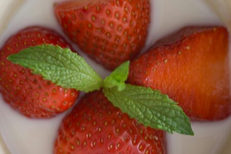 angel delight dessert with almond milk topped with strawberries and mint
