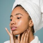 lady applying honey sugar face exfoliator