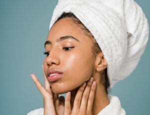 Why Do I Get Hyperpigmentation and How to Avoid It Naturally and Effectively 4 lady applying honey sugar face exfoliator