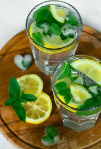 glass of sparkling water with citrus and mint
