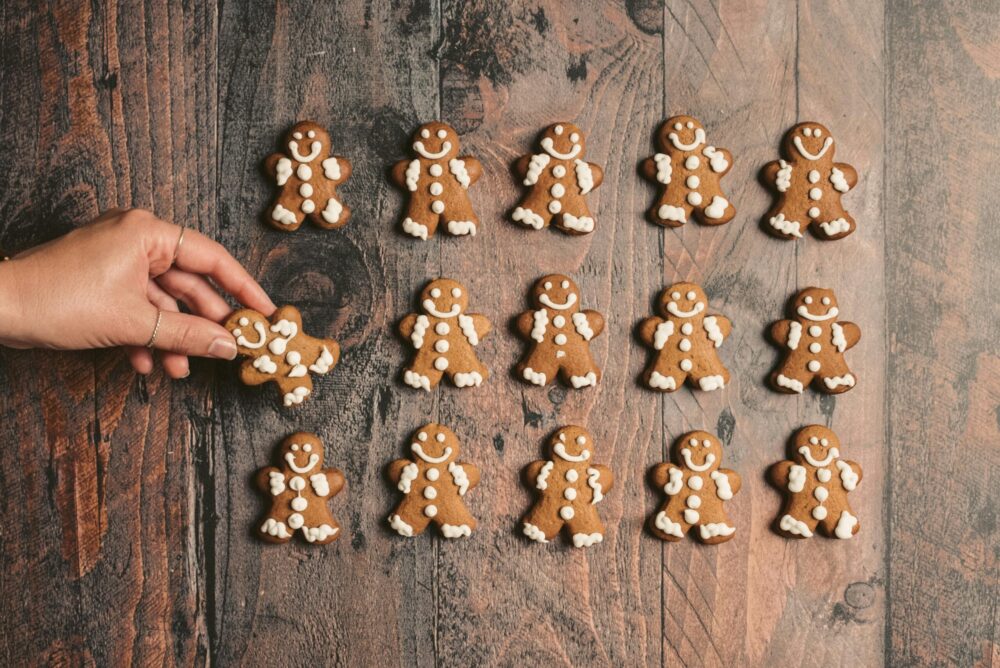 Freshly made gingerbread men making pistachio gingerbread men